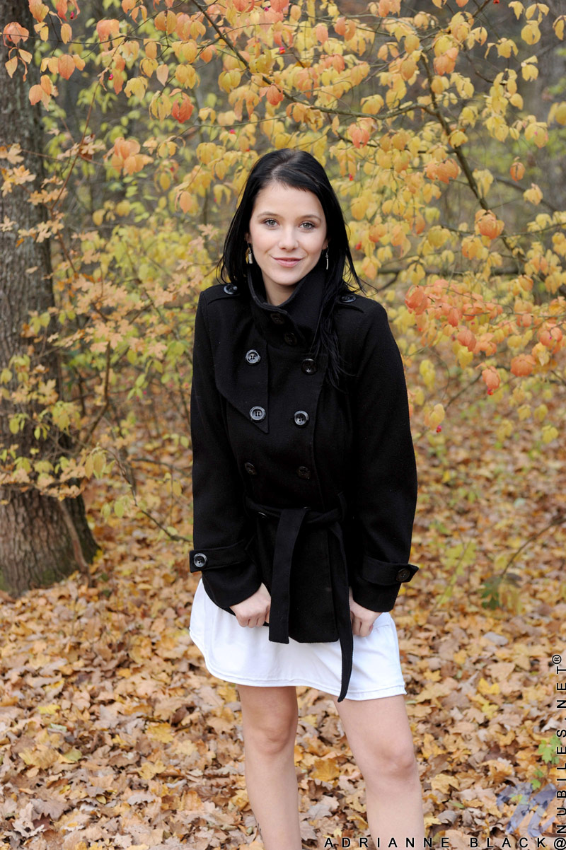 Beautiful Nubile Adrianne Black looks sexy outdoors on an autumn day
