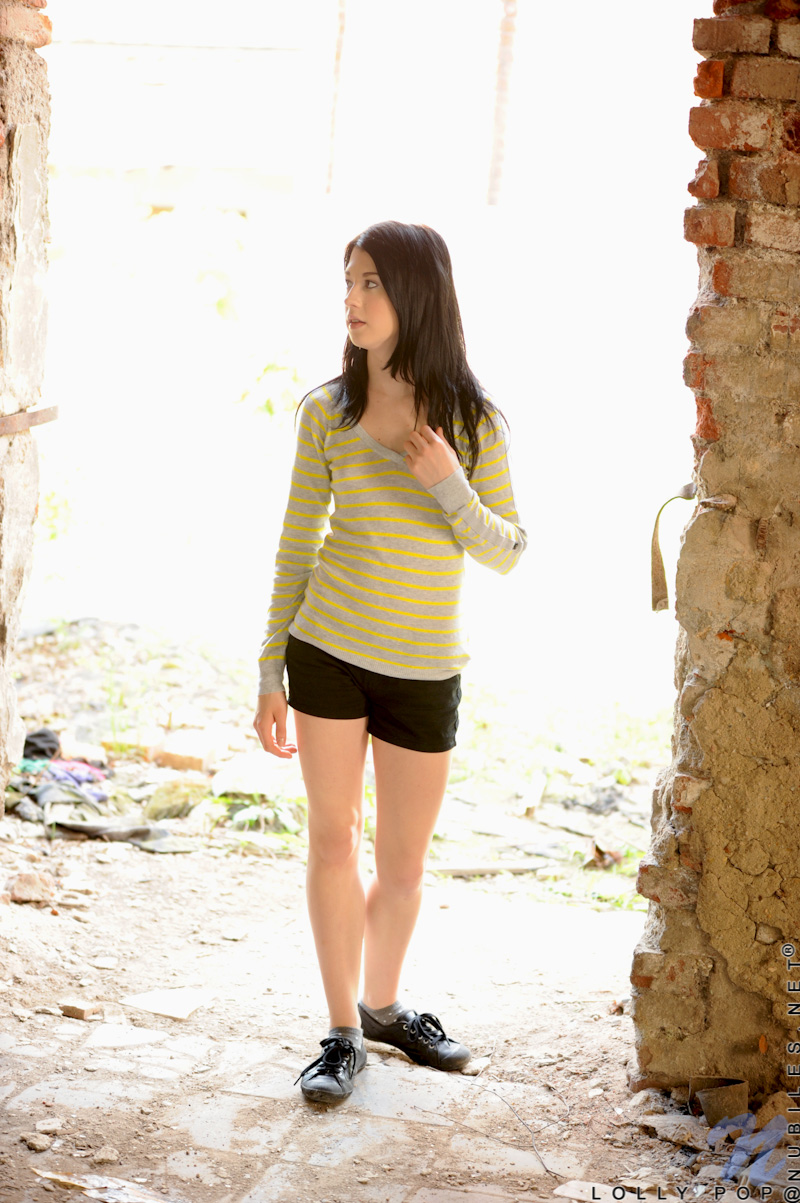 Lolly Pop is so horny as she hides behind the wall and caresses her pussy lips