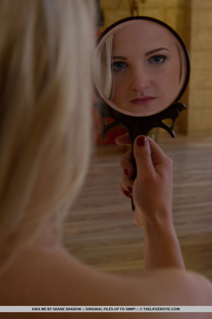 Kira Me bares her lusty body while wearing leather straps as she   erotically poses in front of the camera.