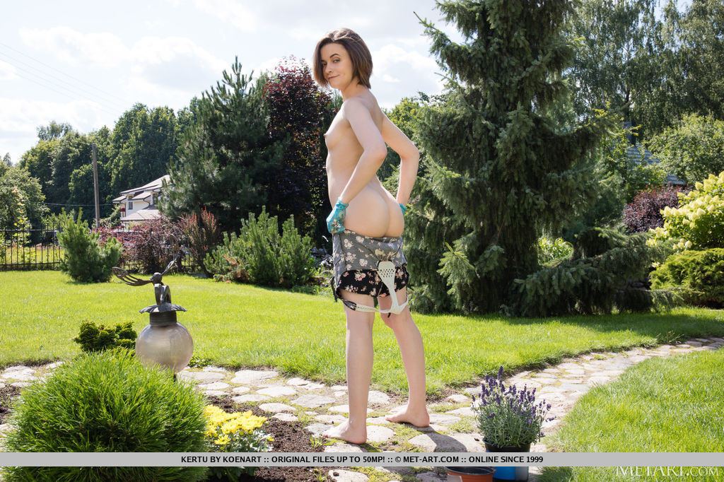Kertu tends to her garden and decides to remove her clothes and flaunts her slender physique and smooth pinkish coochie.