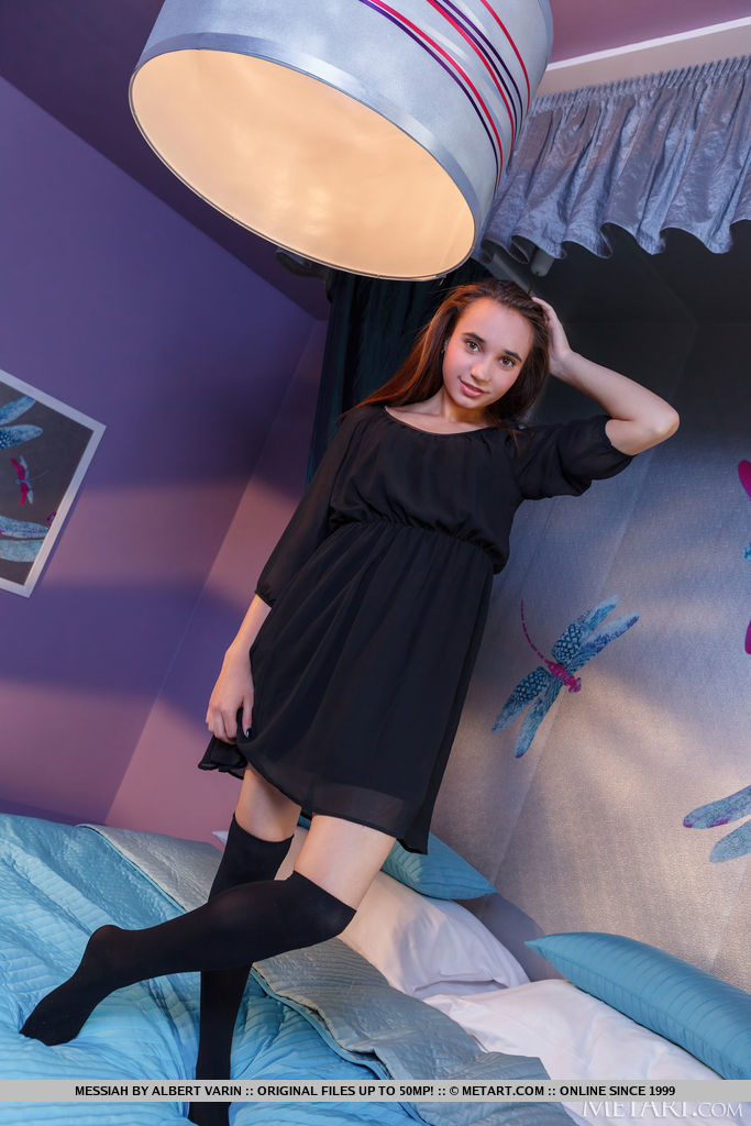 Cute brunette Messiah invites you to join her in the bedroom, her huge brown eyes full of passion as she peels off her long socks and rolls around naked, hands roaming over her sexy small breasts and curvaceous ass.
