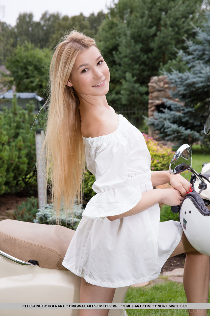 Gorgeous blonde Celestine tries out her new Vespa. She tugs on her white dress and gives a peep of her delicious buns and pinkish fat hairless pussy.