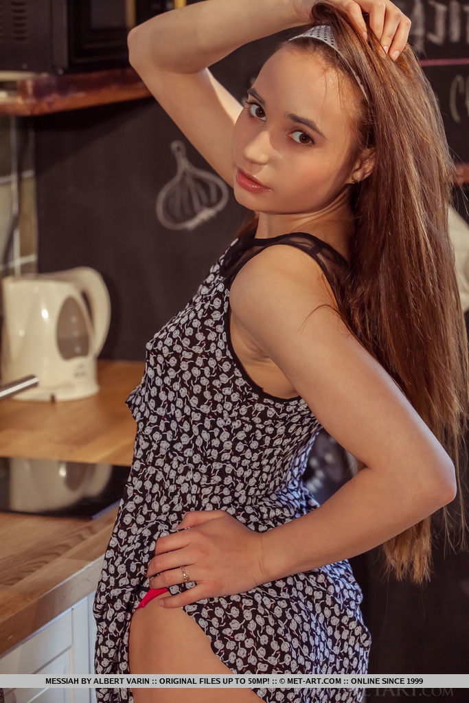 Messiah displays her petite body, small tits and small pussy on the chair.