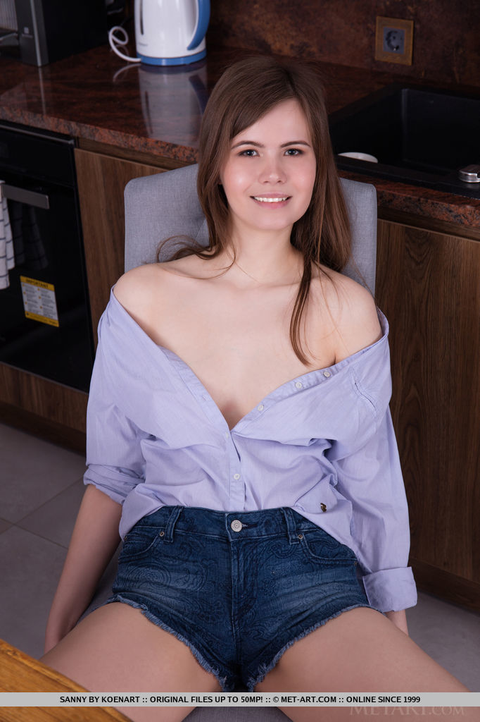 Newcomer Sanny bares her pink, perky nipples and yummy cunt as she strips in the kitchen.